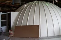 White fiberglass dome cover on a digester tank in Carson, IA
