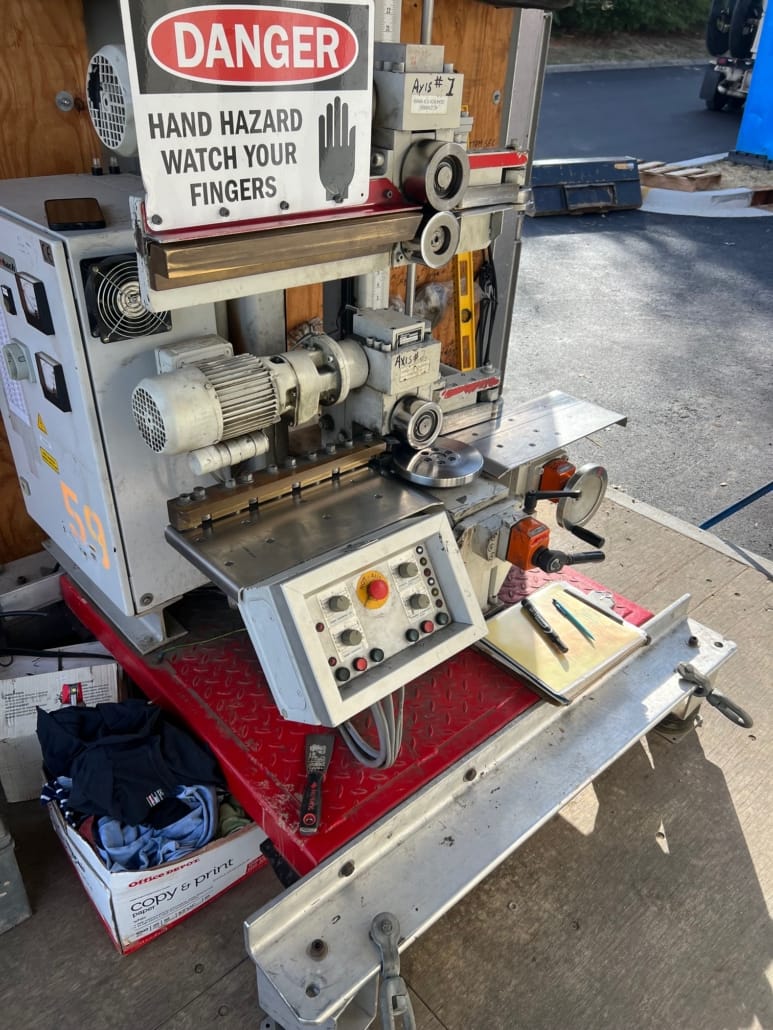 RPS Engineering mobile metal panel curving machine with roller guides and motor assembly — standing seam panel curving equipment used on job sites across Illinois and the Midwest