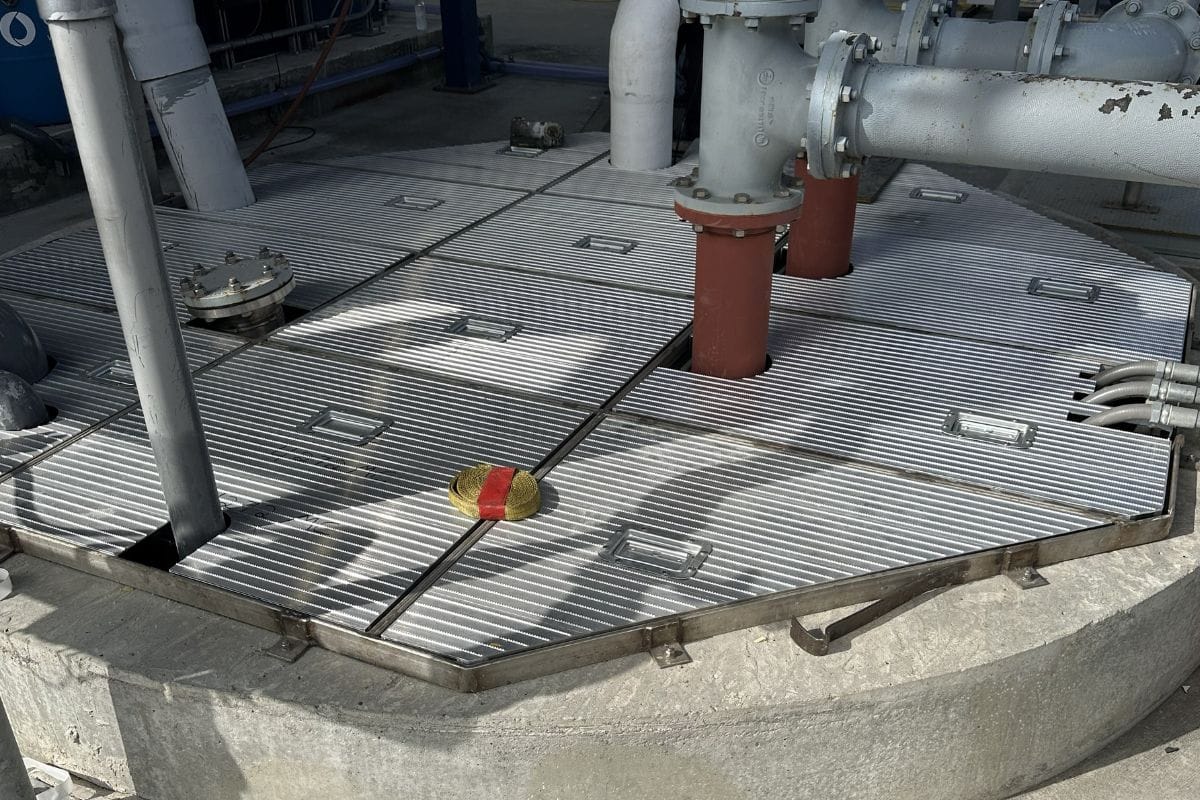 Flat panel wastewater tank cover system installed at municipal treatment facility by RPS Engineering