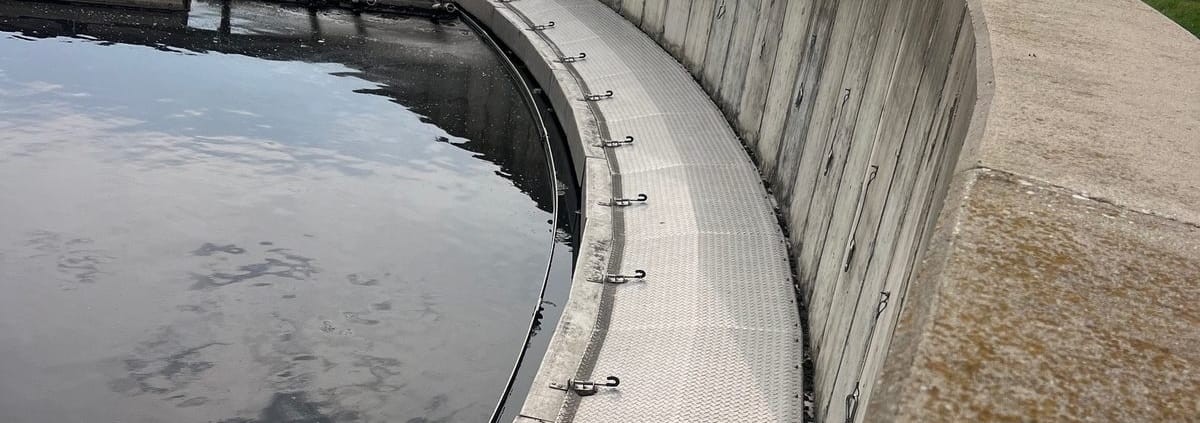 RPS Engineering aluminum launder covers on a circular clarifier preventing algae growth